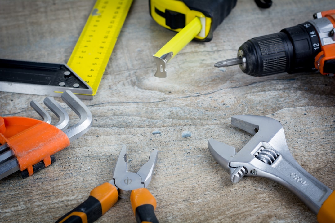Construction tools on wooden background with copy space. Finance loan business concept, Repair maintenance concept. More of my photos and videos Adobe Stock:http://bit.ly/3RqlciK More of my photos and videos Shutterstock: https://www.shutterstock.com/g/ALEKSANDRBERDYUGIN My email: bermix999@gmail.com