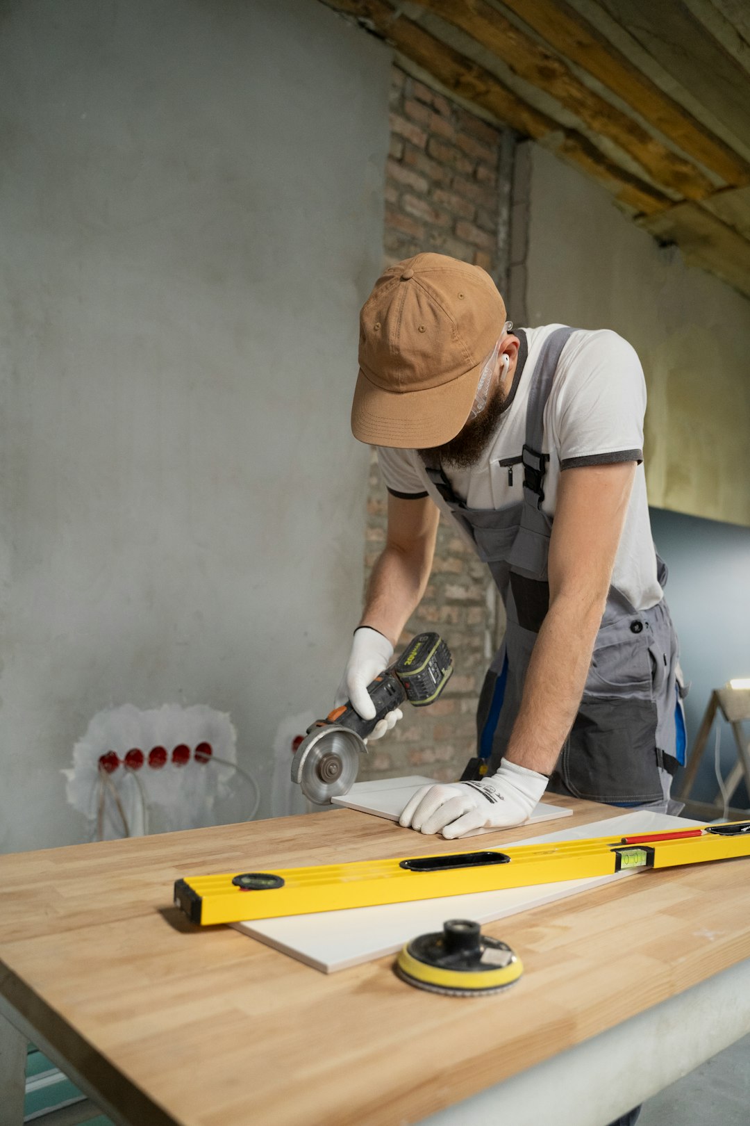 a-man-sanding-a-wooden-table-with-a-sander-6dnuvvieir8